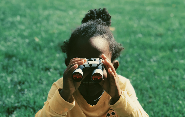 5-8 girl with binoculars.png