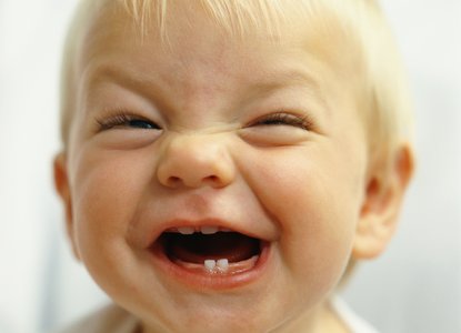 Close up of a happy baby with a big, toothy smile!