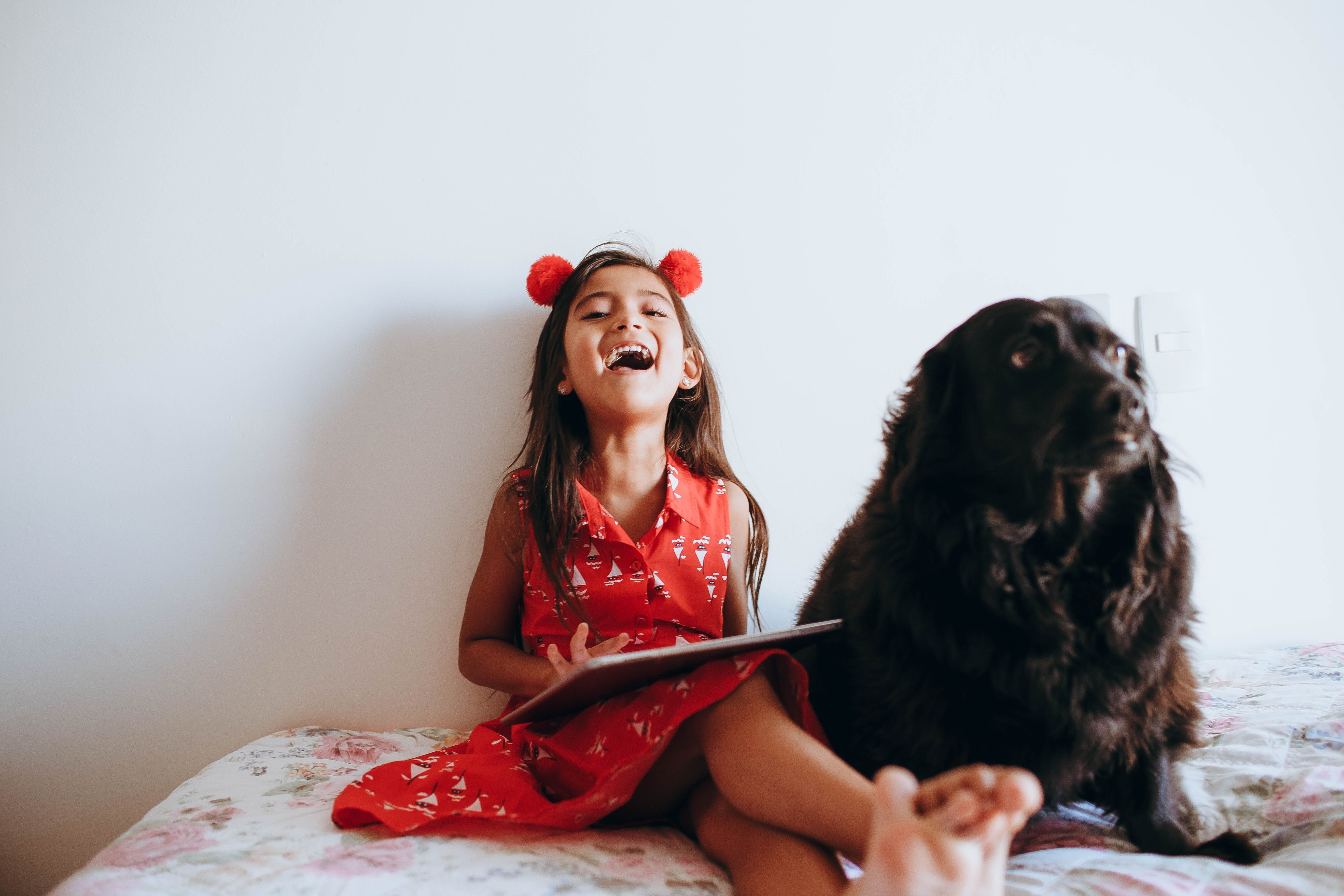 Girl with book and dog
