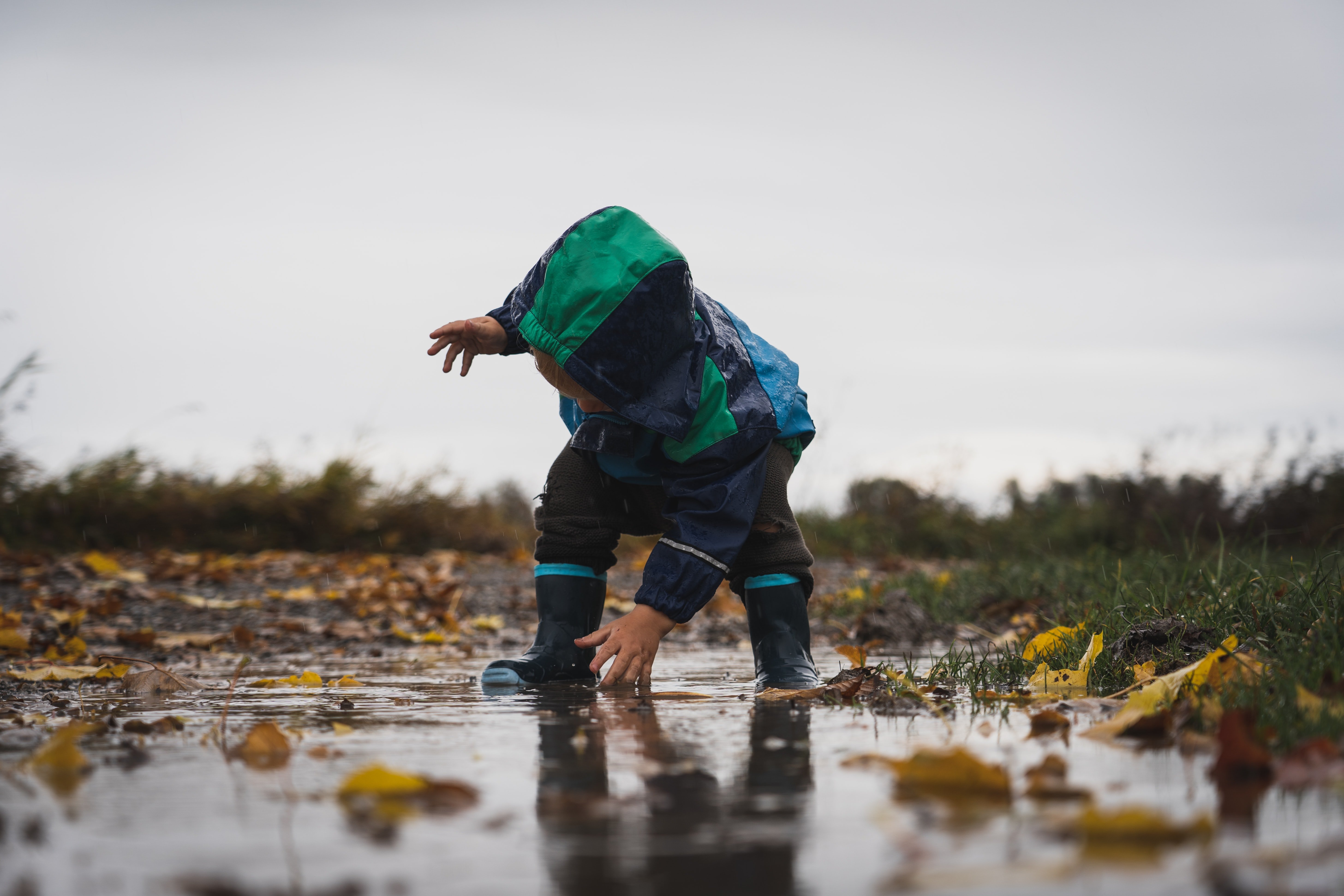 child in puddle