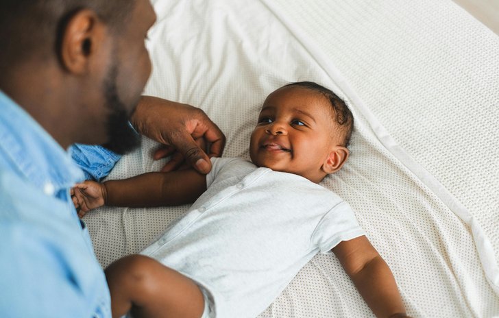 Dad and baby face to face