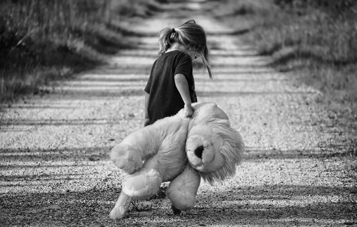 girl with lion toy