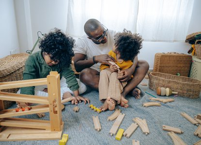 Parent playing with toys with children